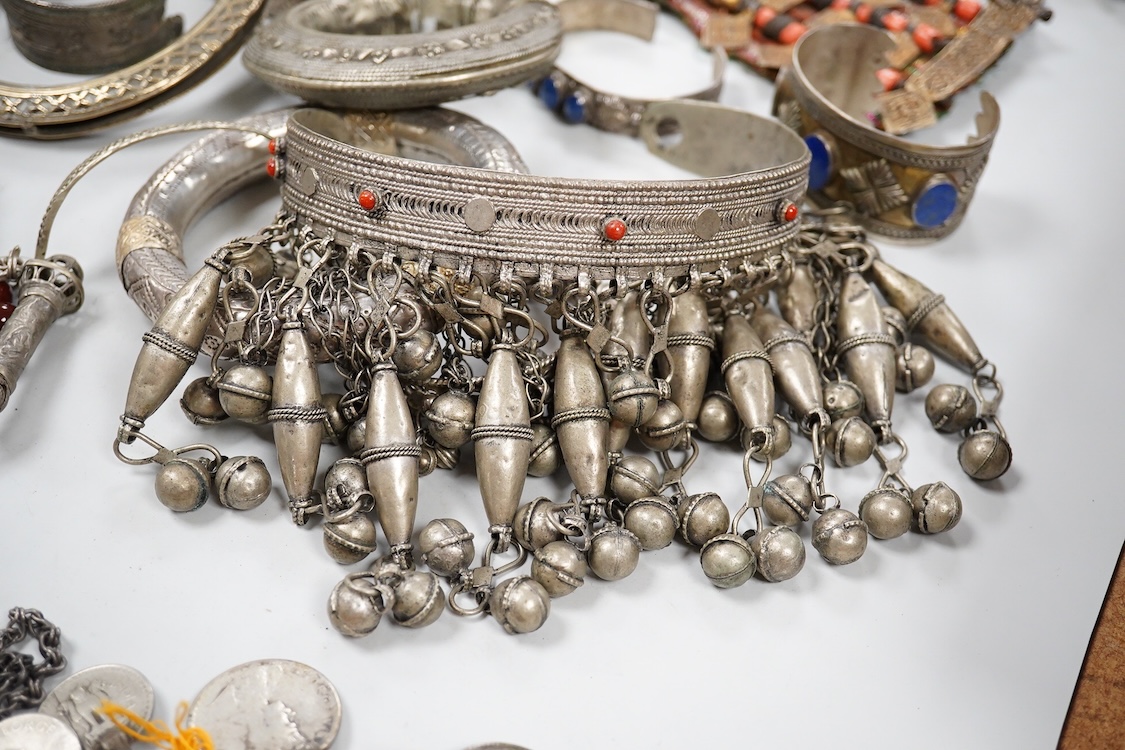 A collection of Bedouin white metal, gilt metal, lapis lazuli mounted jewellery, etc. from Oman